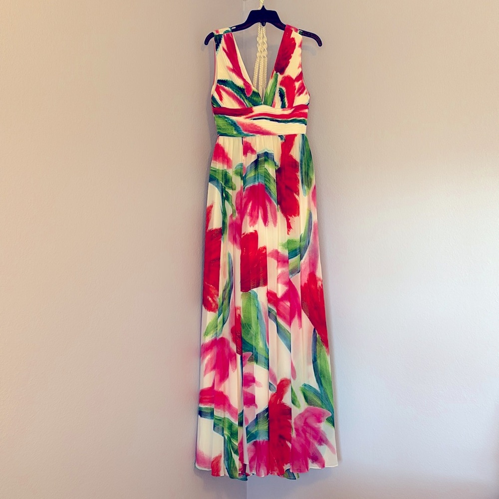 Beautiful, light flowing dress with one thigh high slit.  Never worn with tags.